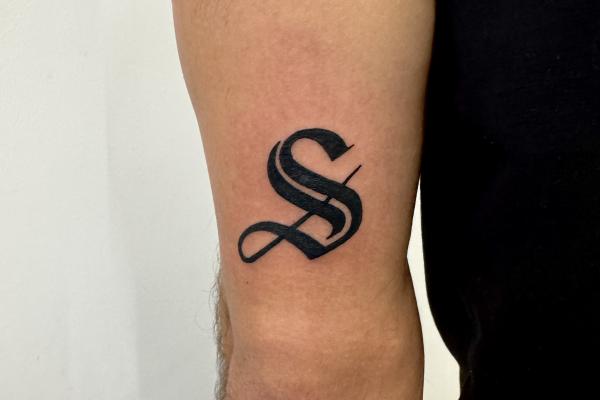 Blackwork Script S Tattoo