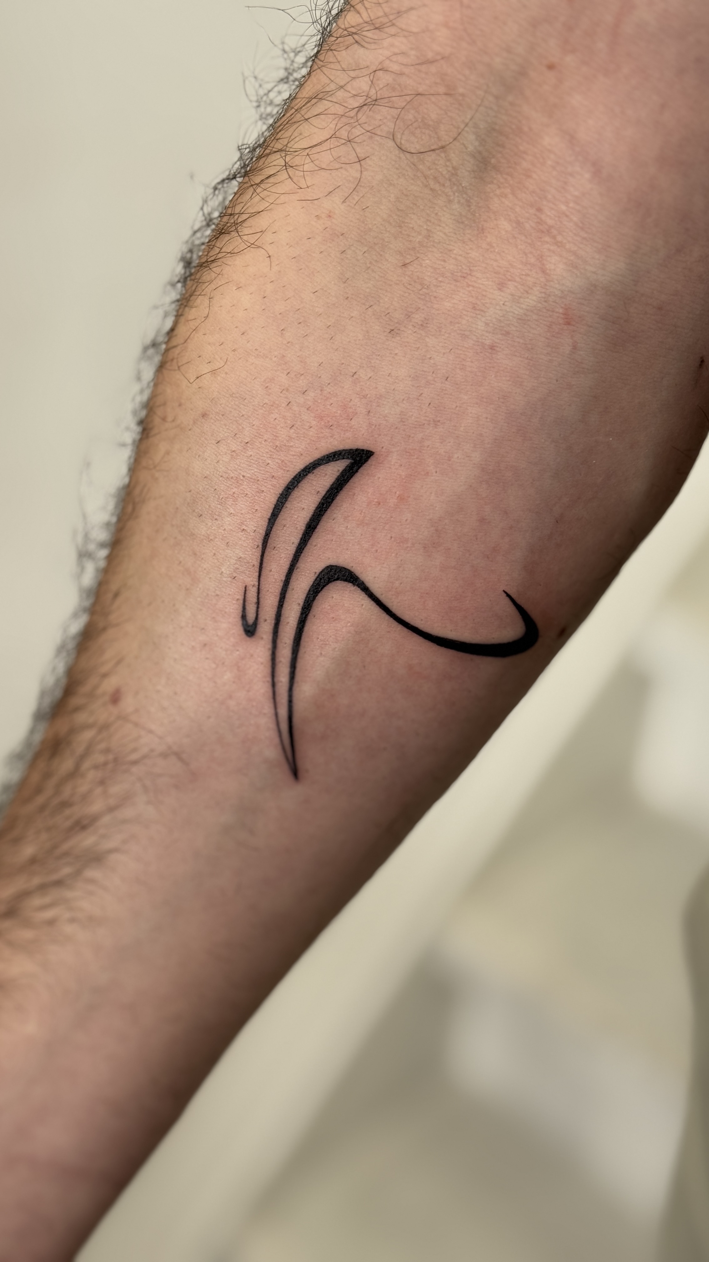 Fineline Abstract Pickaxe Tattoo